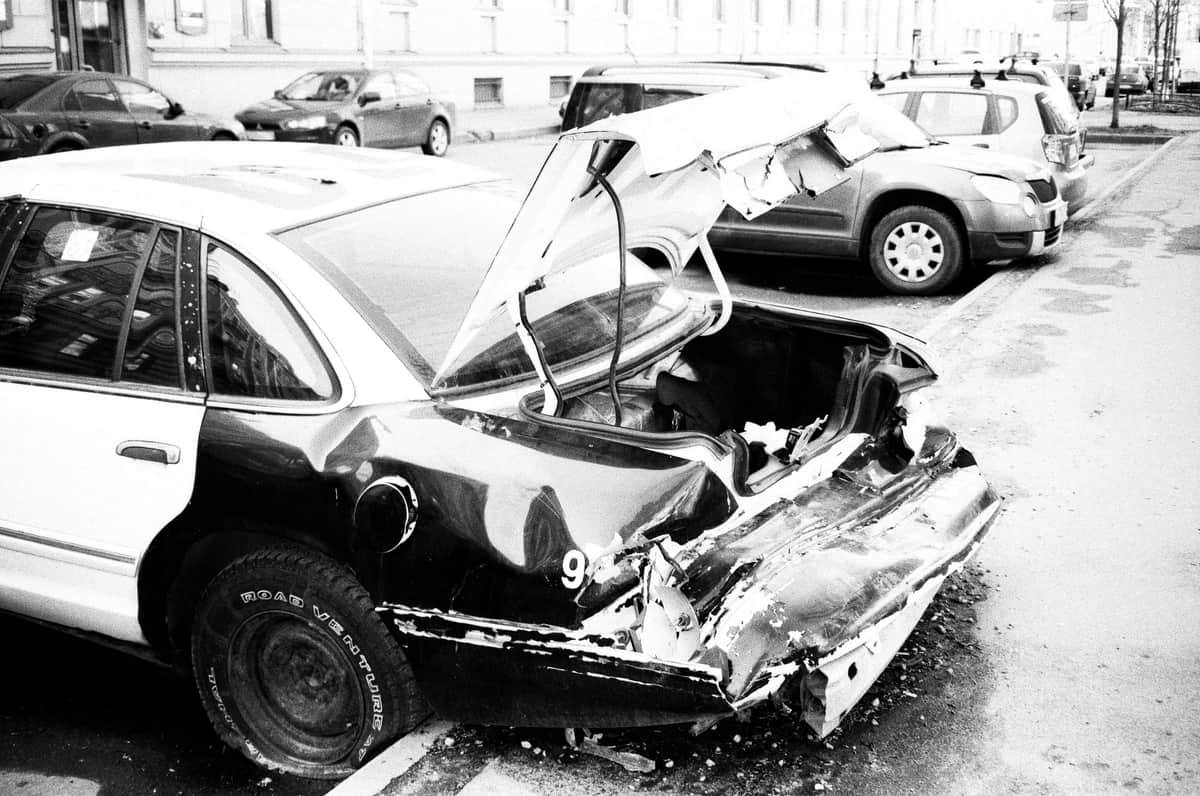 A minor collision between two cars on a road