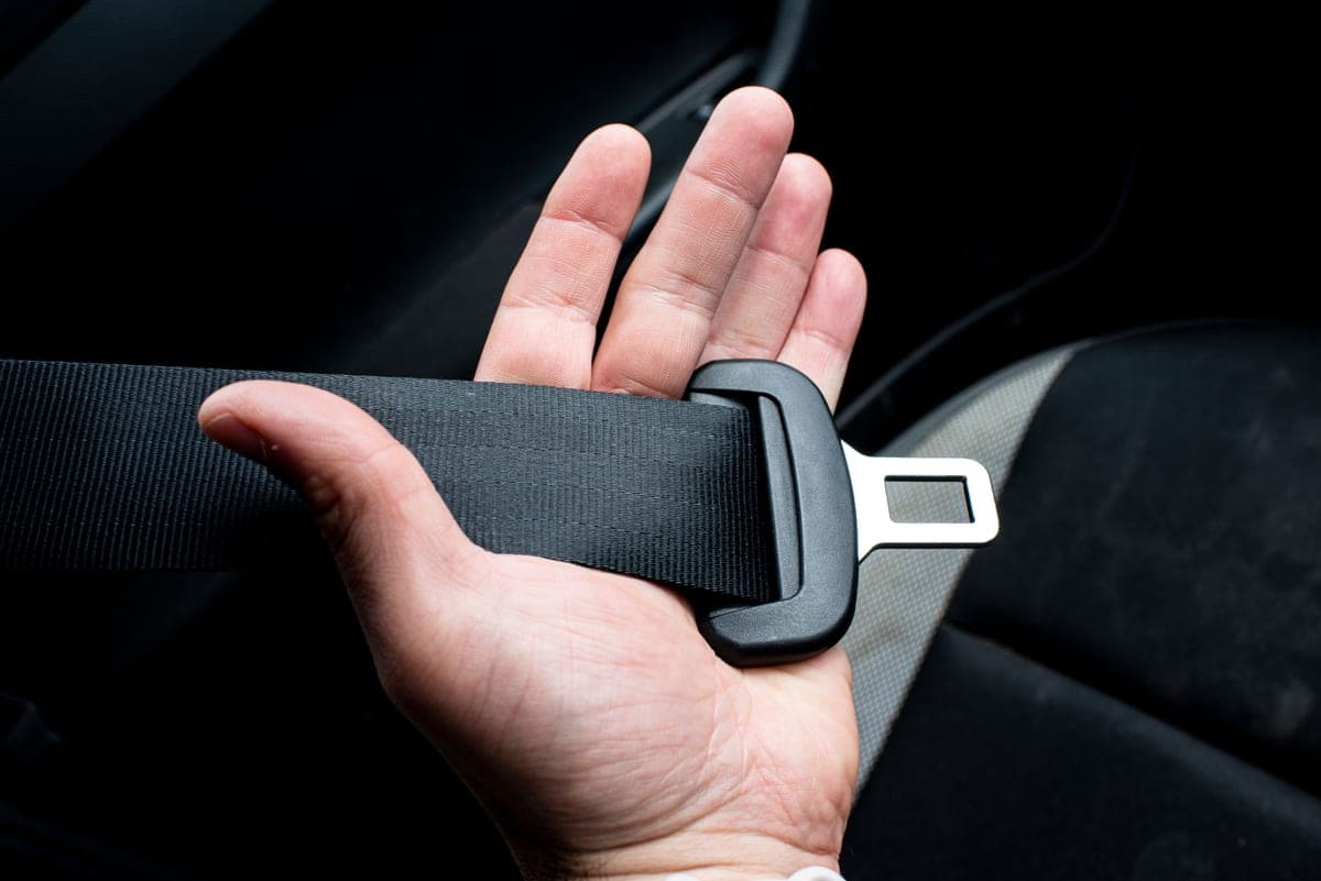 A car seat belt buckle in close up
