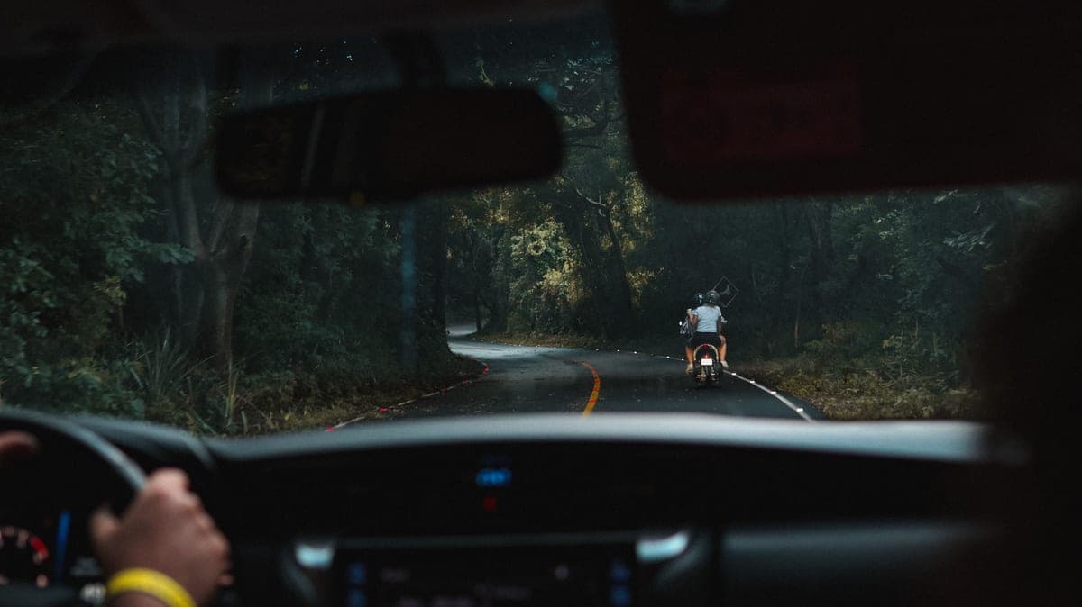A sharp view of the road ahead through a car windshield