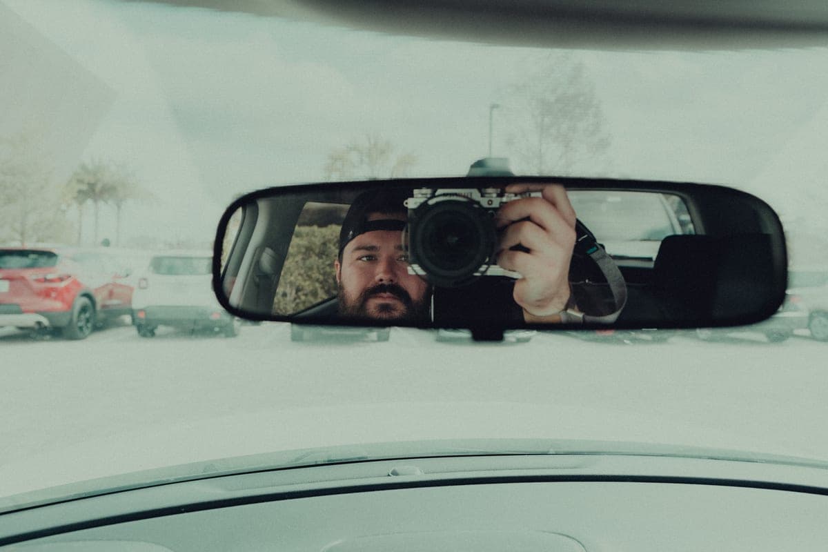 A small dash camera device mounted on a windshield