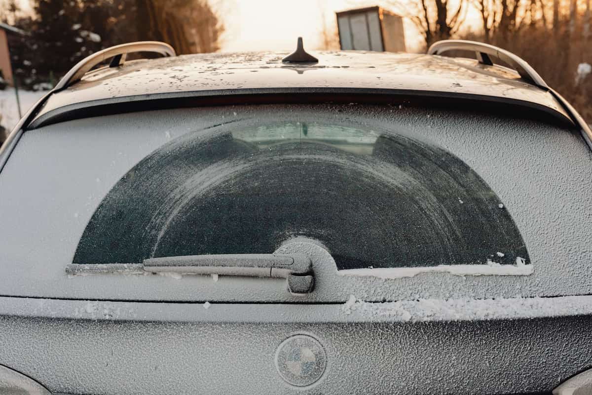 Frost patterns across a car's rear window