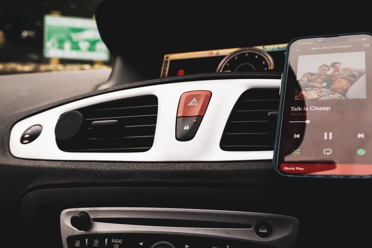 A magnetic phone holder clipped to a car air vent