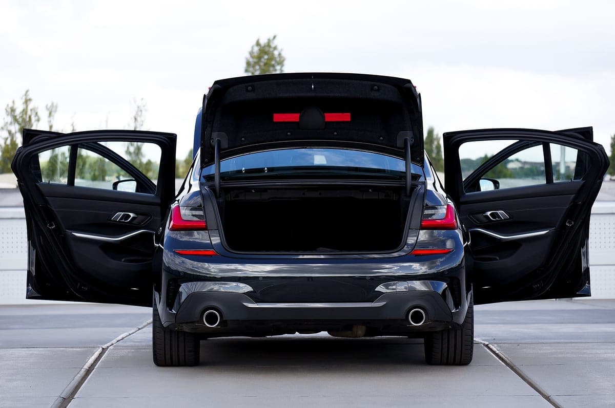 The open trunk of a sedan car