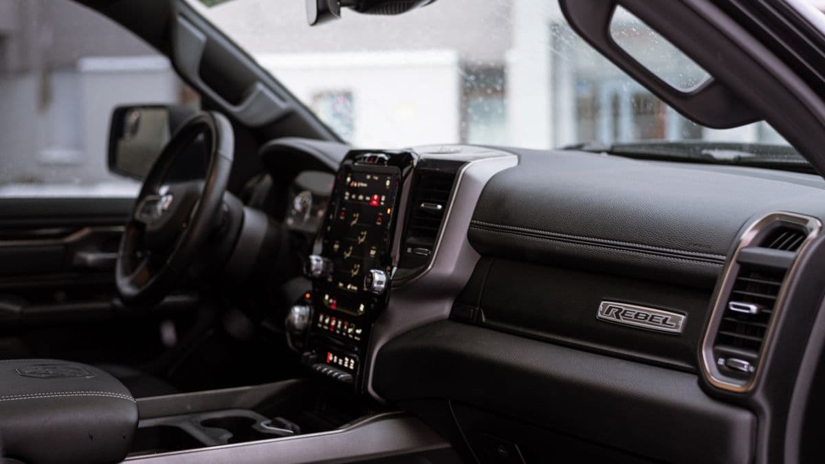 The dashboard and front seats inside a modern pickup truck