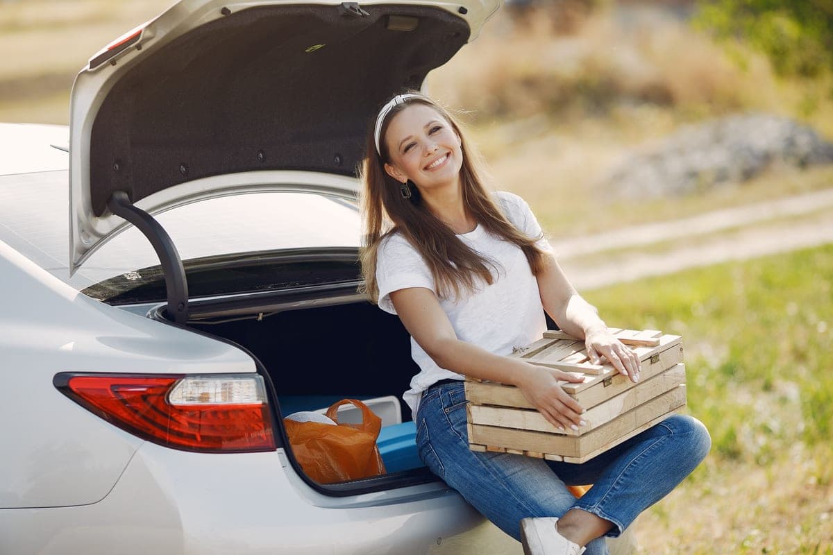 A cooler box in a car trunk ready for a road trip