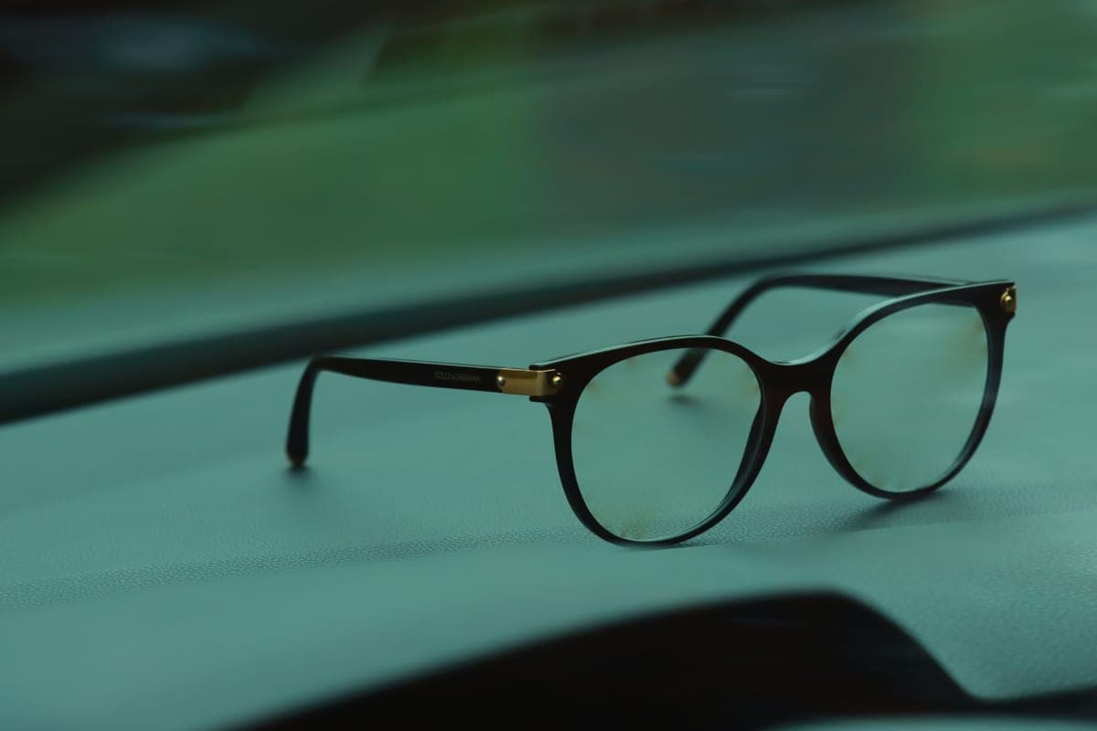 Sunglasses resting on a car dashboard