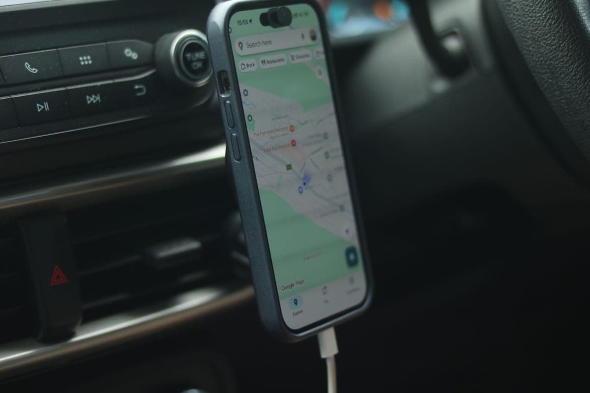 A phone charging wirelessly in a car