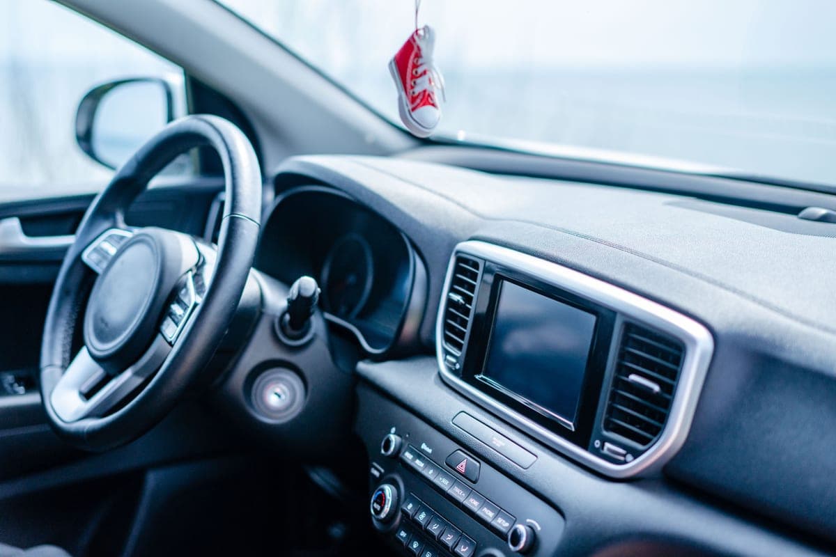 The gap between a car seat and the center console in close up