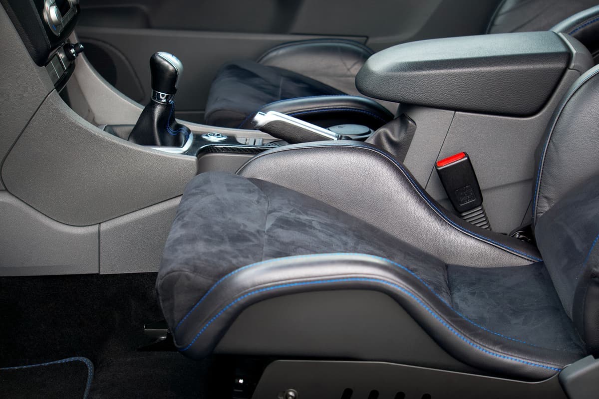 Two car seat interiors side by side showing the console gap