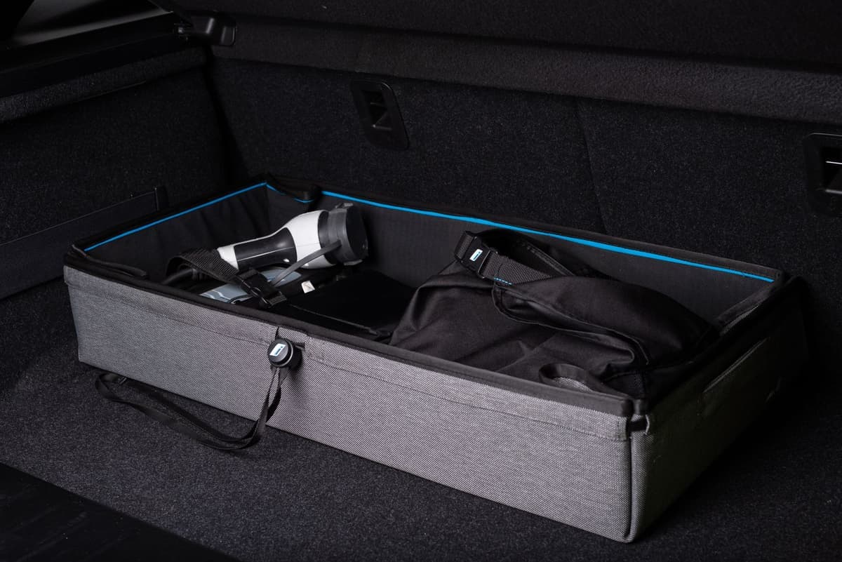 A storage box organizing the trunk of a car