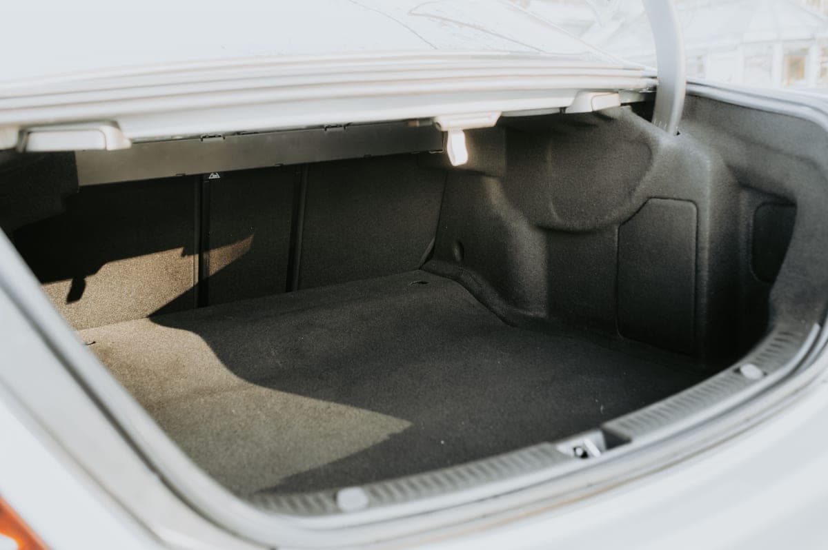An empty car cargo floor with a liner