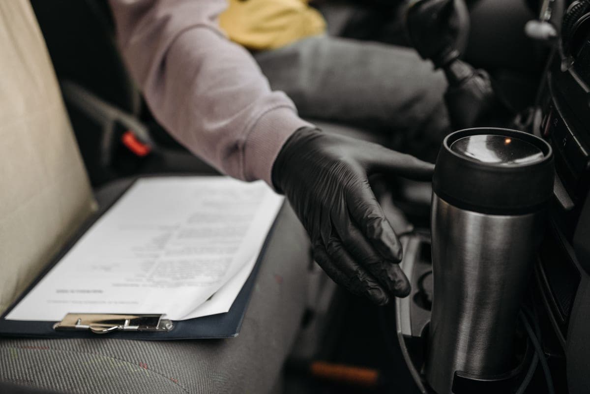 A car owner manual and documents in a glove box