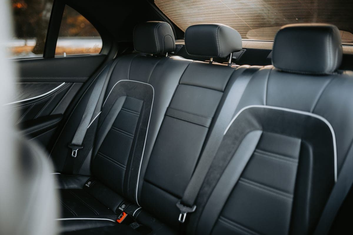 A child car seat installed in the back seat of a car